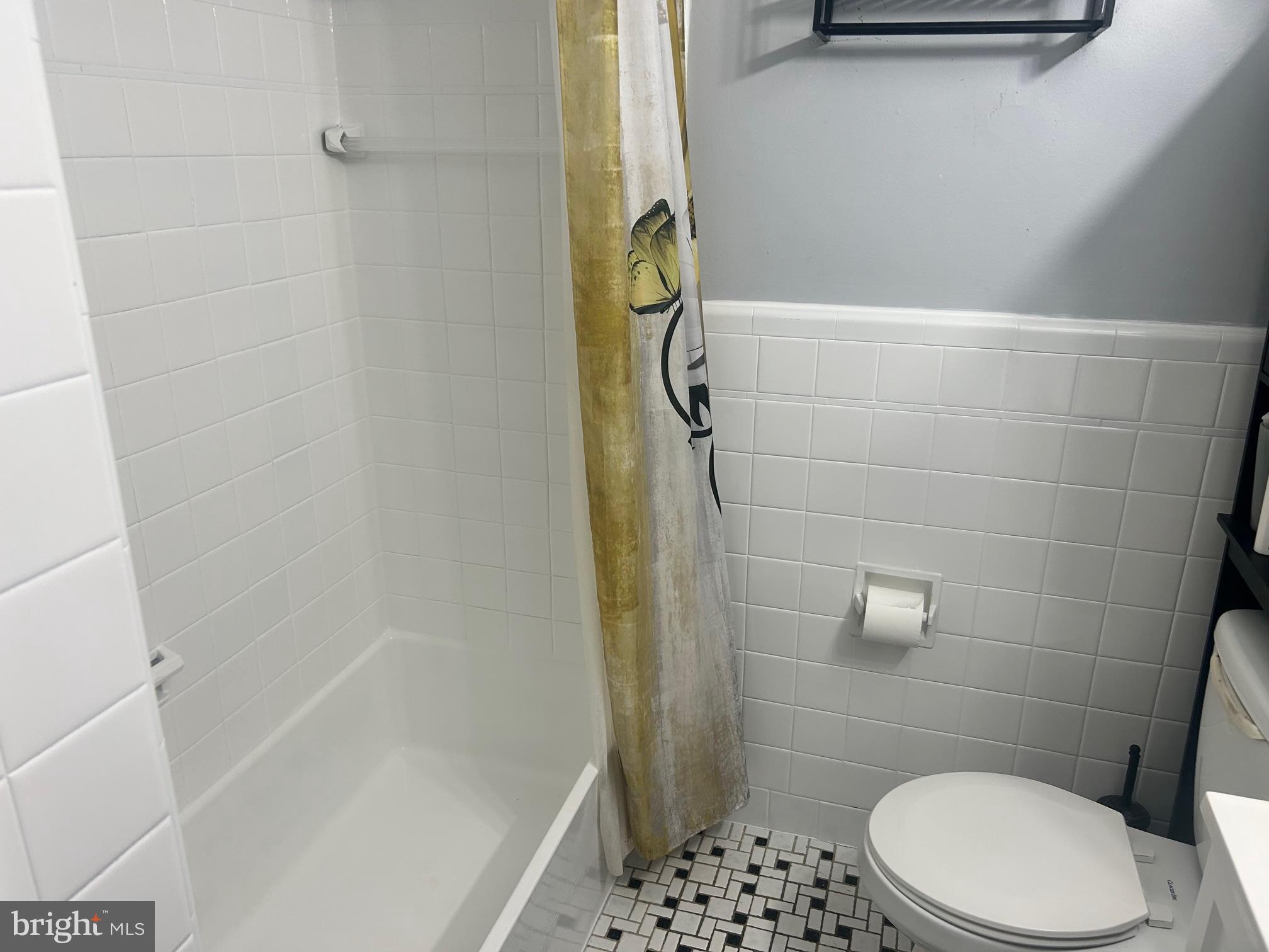 306 Golf Road Darby, PA 19023 - Photo 12 of 14 a bathroom with a shower and toilet