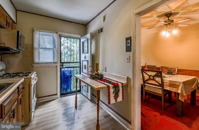 a kitchen with stainless steel appliances granite countertop a stove and a refrigerator