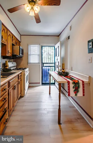 a kitchen with stainless steel appliances granite countertop a stove and a refrigerator