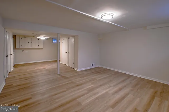 a view of a room with gym equipment and a window
