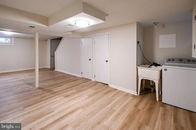 a white toilet sitting next to a shower