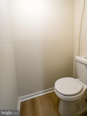 a view of a backyard with large trees