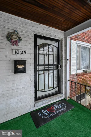 a living room with furniture a rug and a fireplace