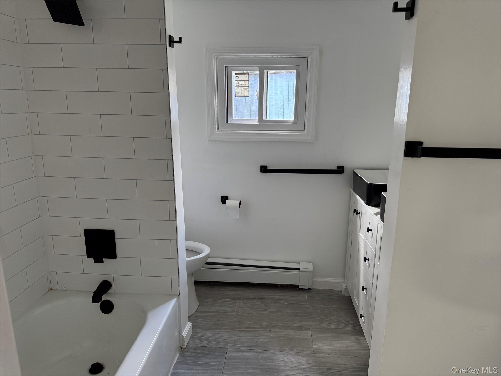 273 Blind Pond Road Narrowsburg, NY 12764 - Photo 19 of 29 a bathroom with a tub and a sink