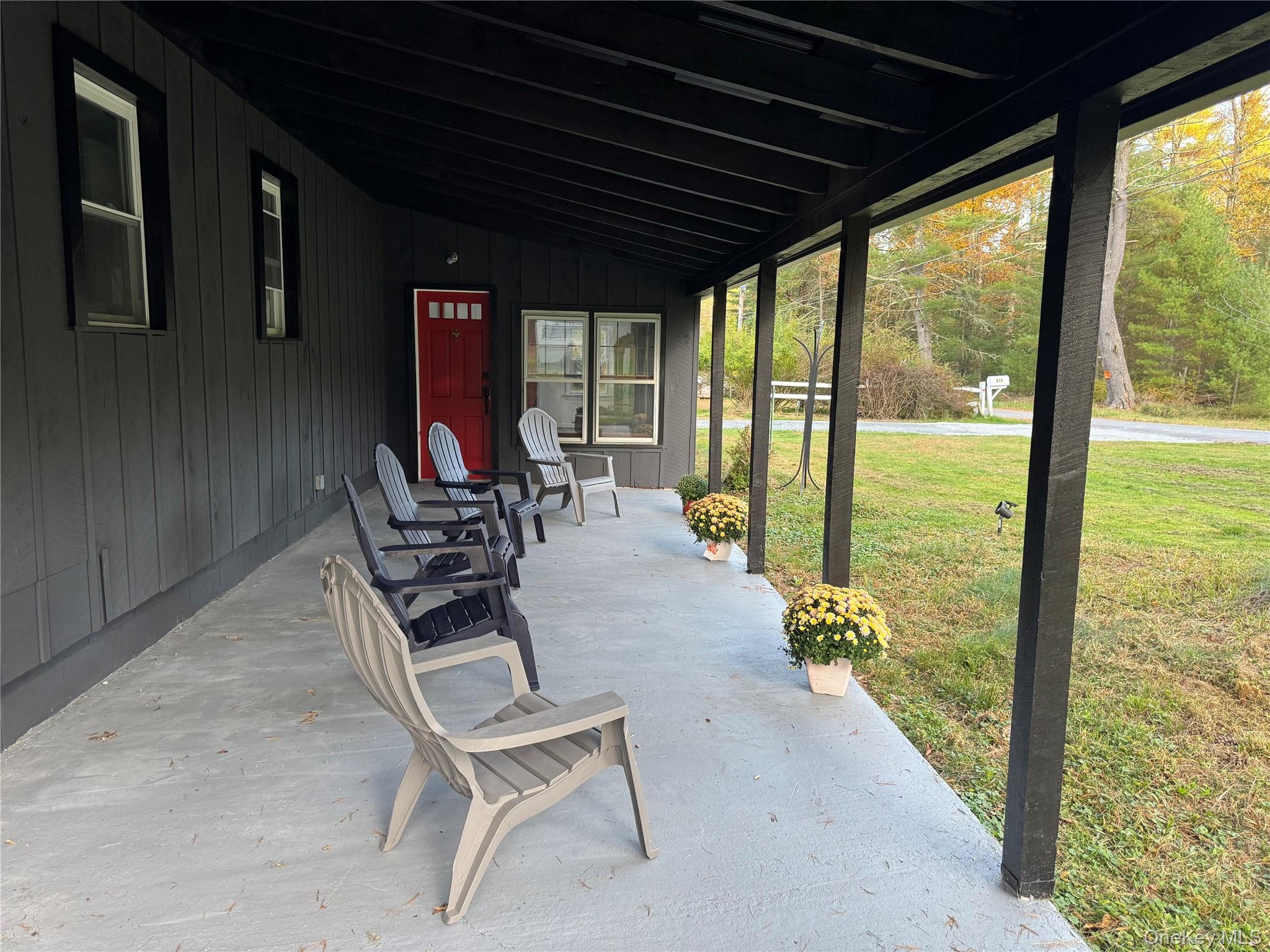 273 Blind Pond Road Narrowsburg, NY 12764 - Photo 2 of 29 a view of a porch with chairs and backyard