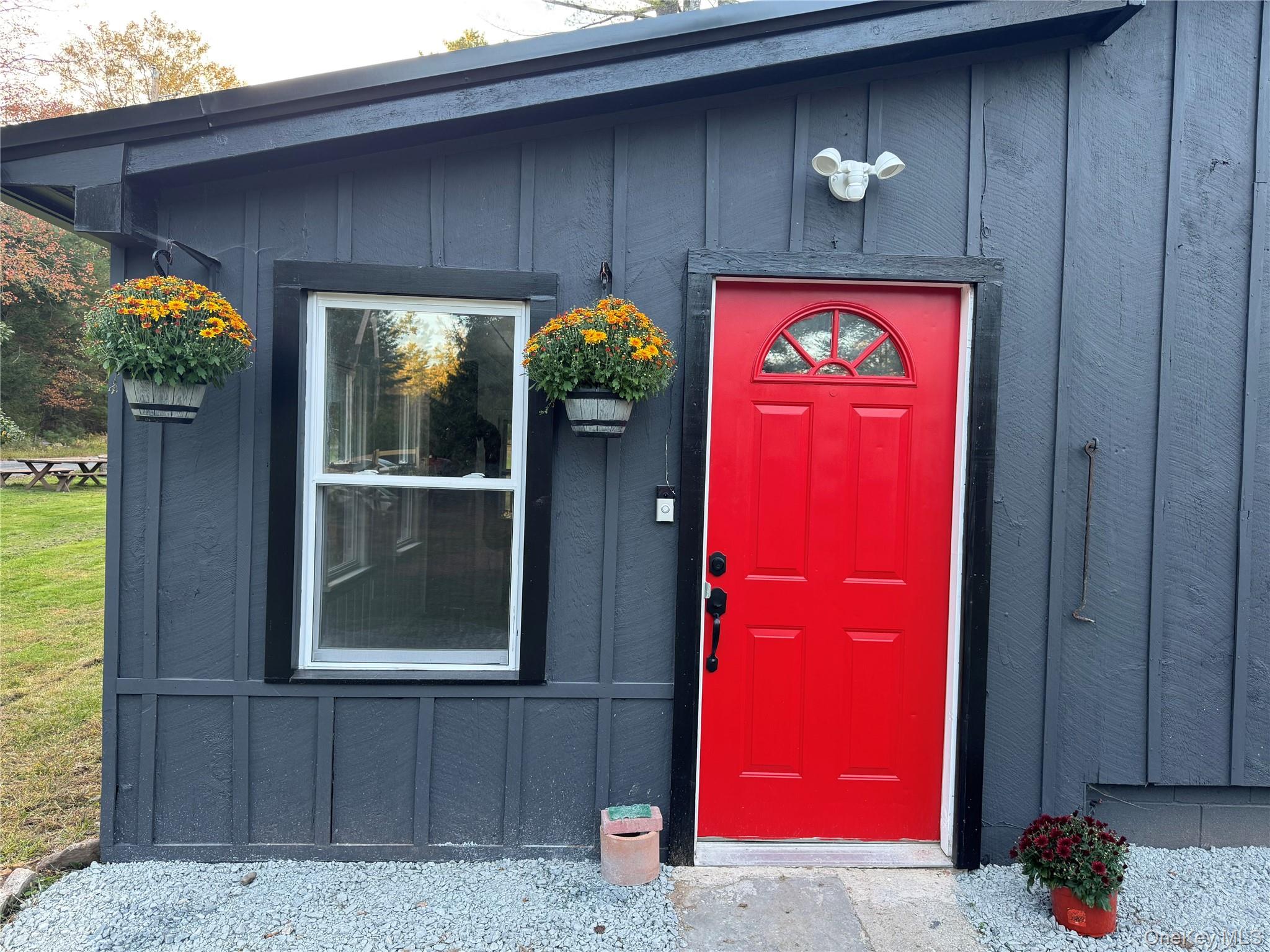 273 Blind Pond Road Narrowsburg, NY 12764 - Photo 5 of 30 View of exterior entry with board and batten siding