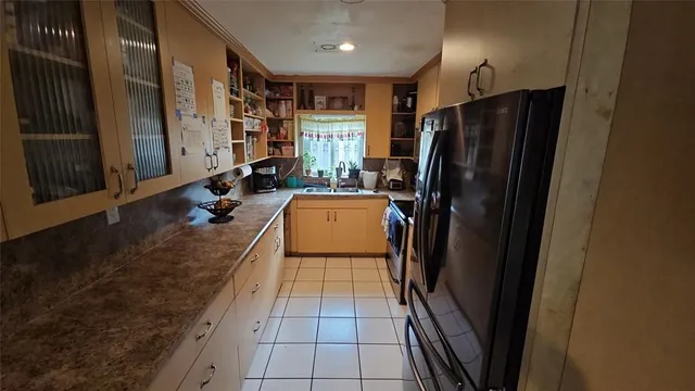 a kitchen with refrigerator and washer