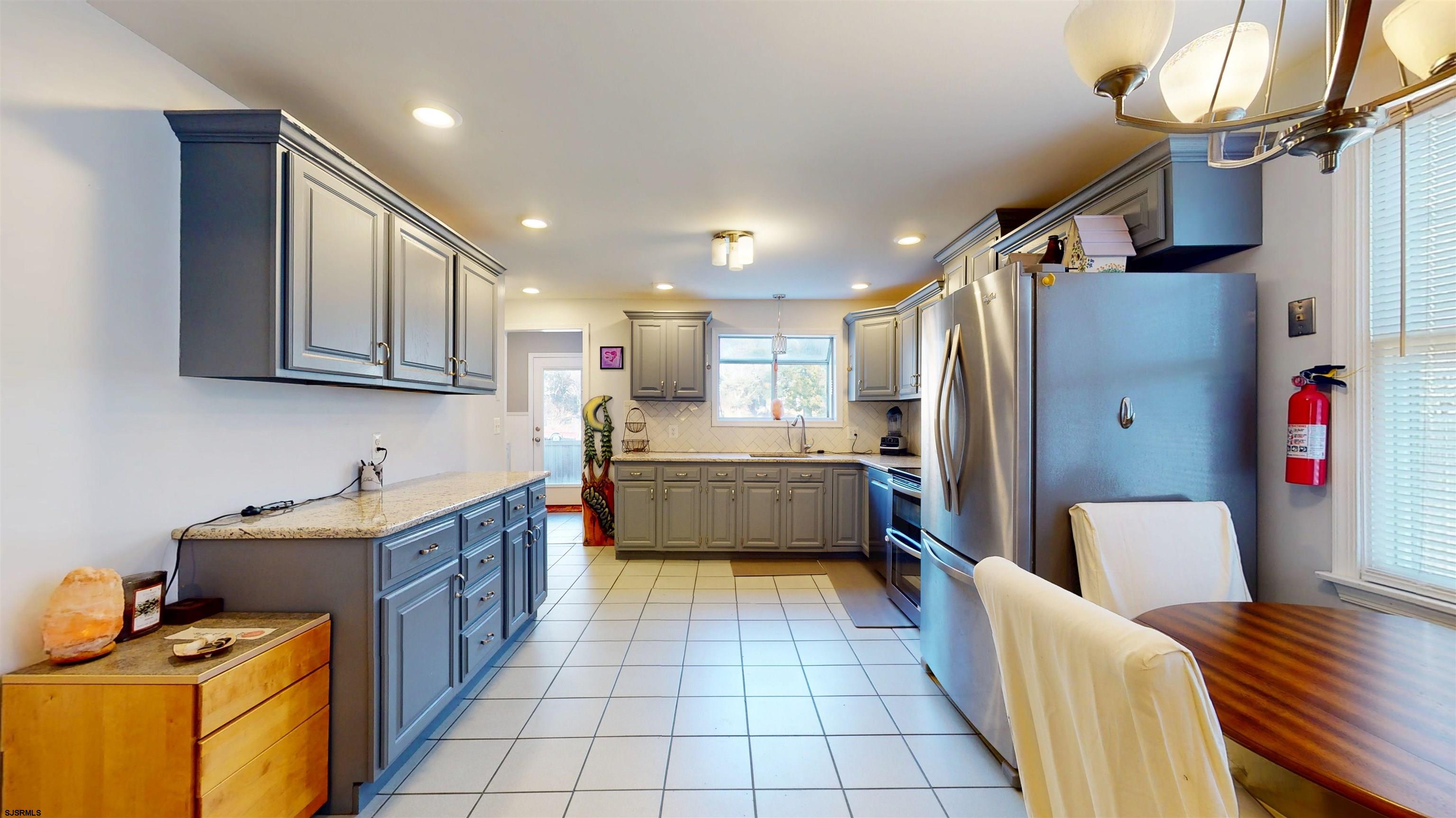 64 Clarks Landing Road Port Republic, NJ 08241 - Photo 12 of 63 a kitchen with stainless steel appliances a refrigerator and a sink