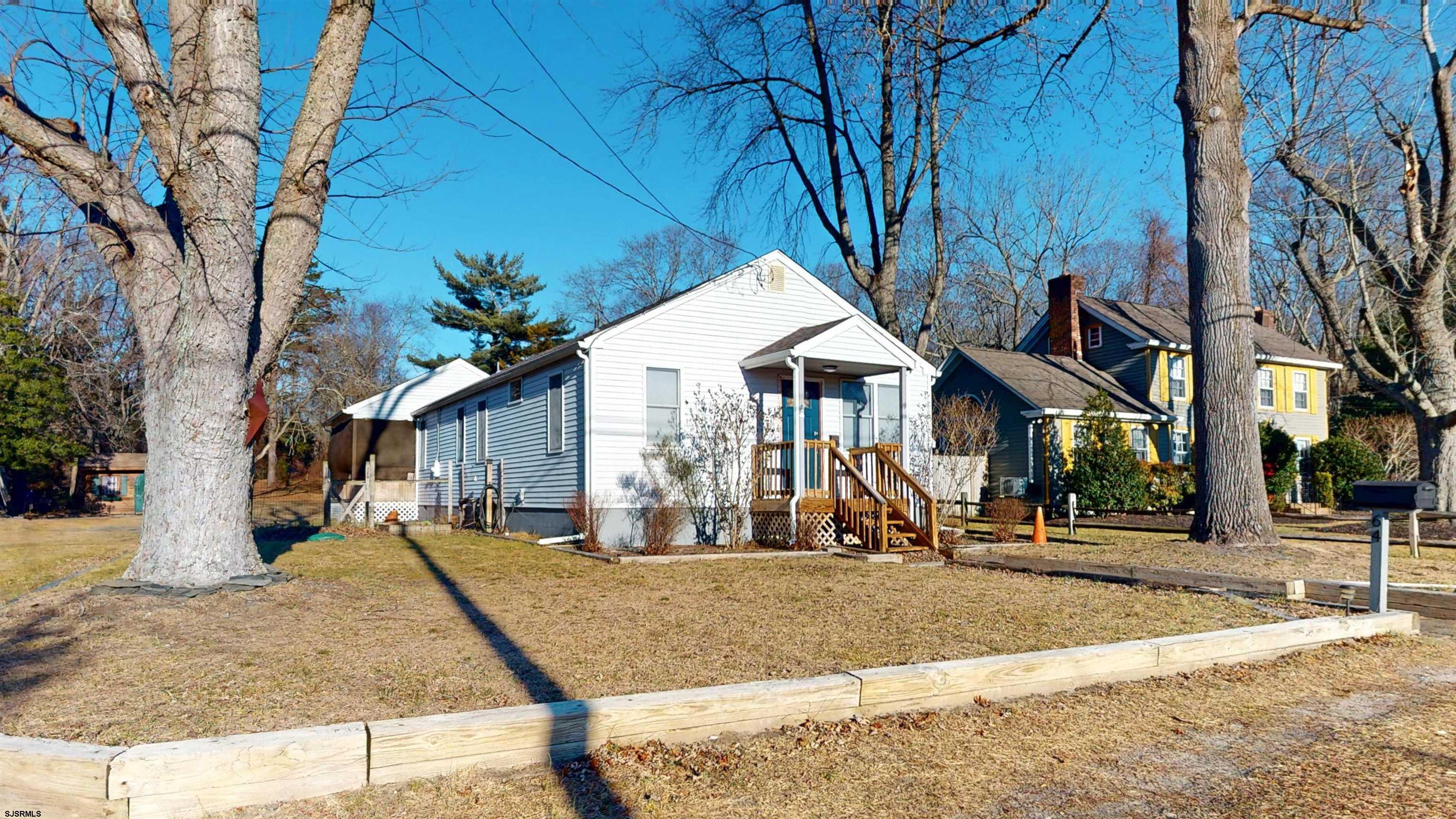 64 Clarks Landing Road Port Republic, NJ 08241 - Photo 2 of 63 a view of a white house with a small yard