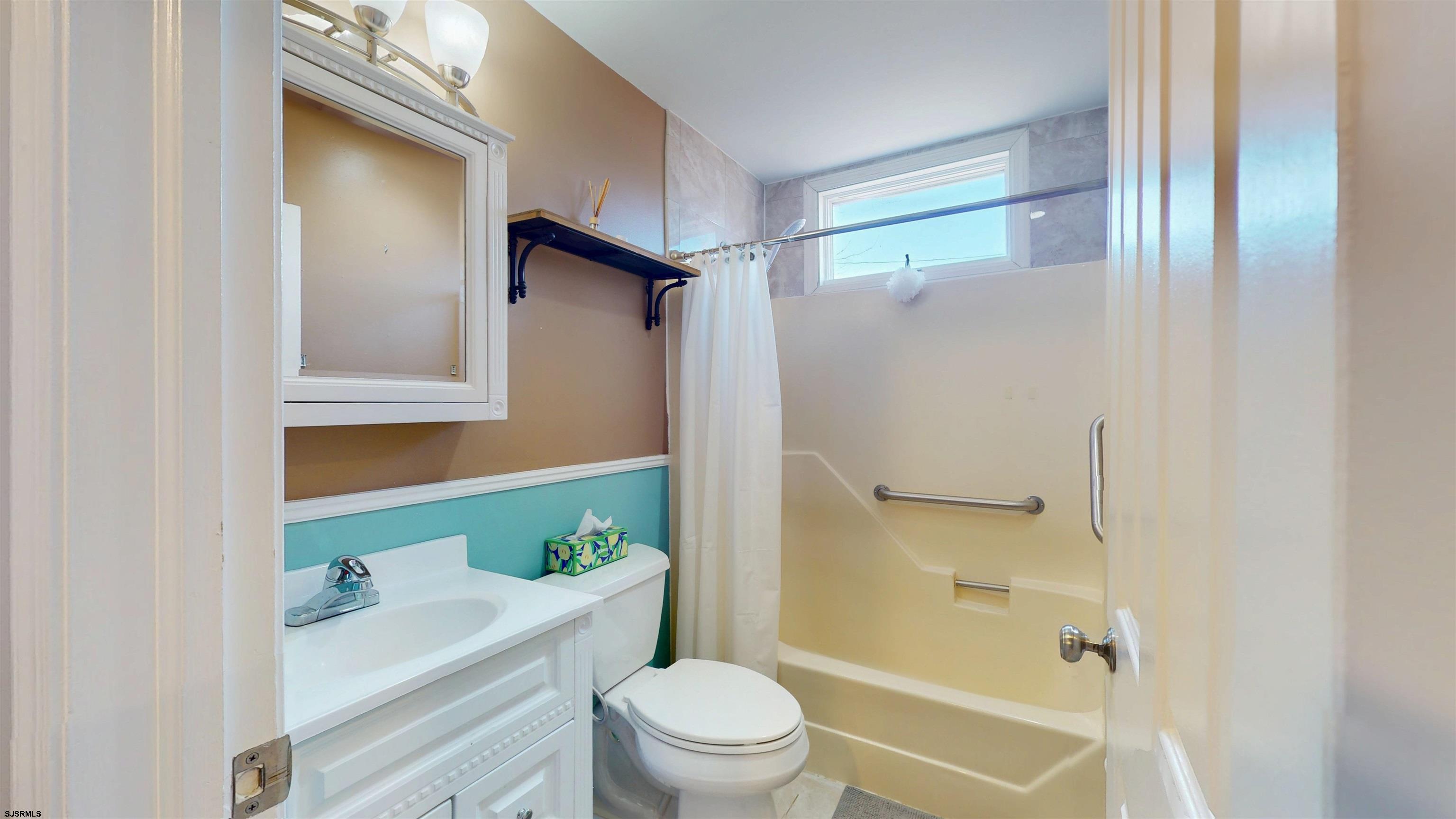 64 Clarks Landing Road Port Republic, NJ 08241 - Photo 26 of 63 a bathroom with a sink a toilet a mirror and shower