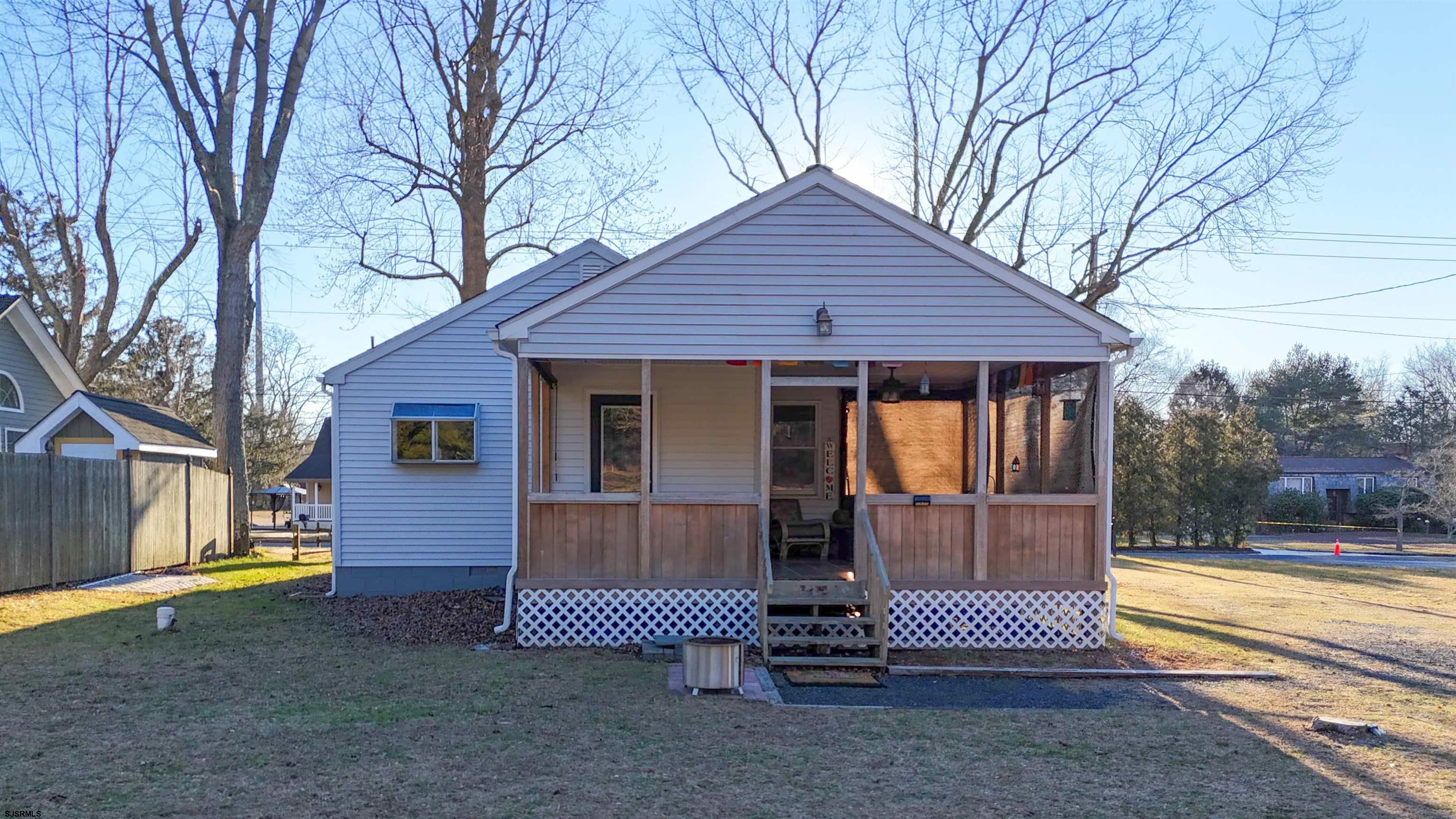 64 Clarks Landing Road Port Republic, NJ 08241 - Photo 44 of 63 a front view of a house with garden