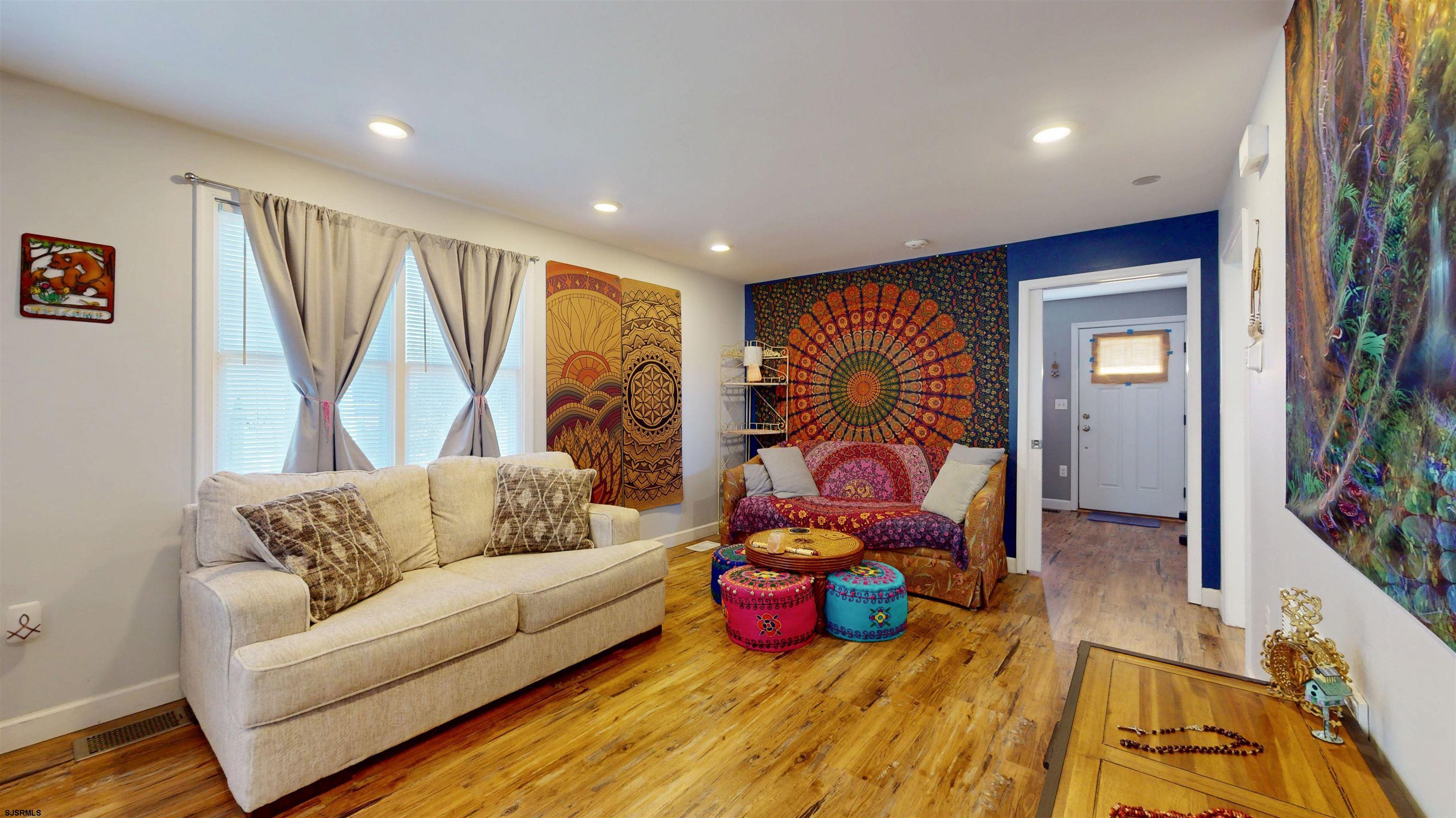 64 Clarks Landing Road Port Republic, NJ 08241 - Photo 8 of 63 a living room with furniture and a flat screen tv
