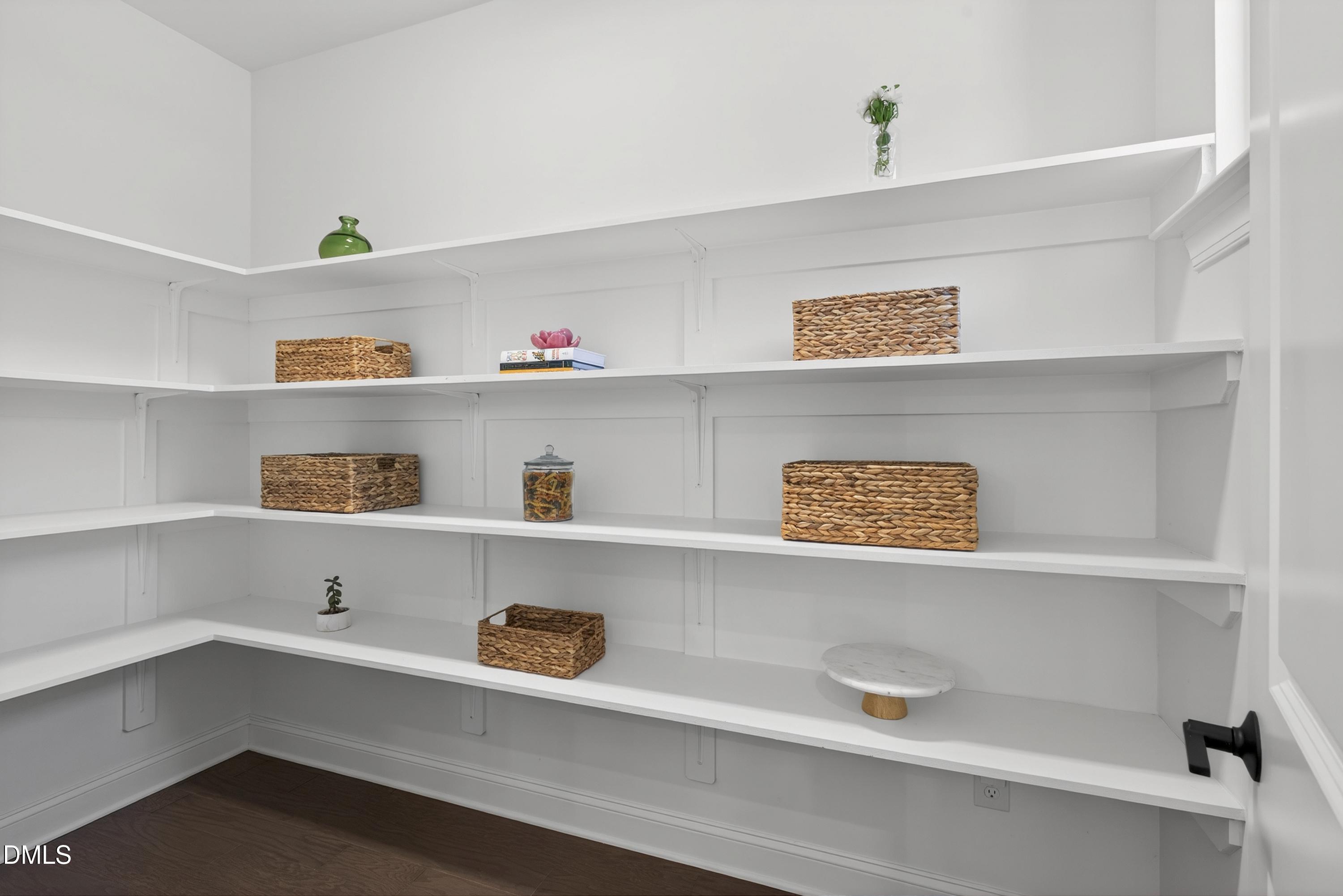 1063 Danvers Loop Apex, NC 27523 - Photo 26 of 67 a shelf with books and knick knacks on it