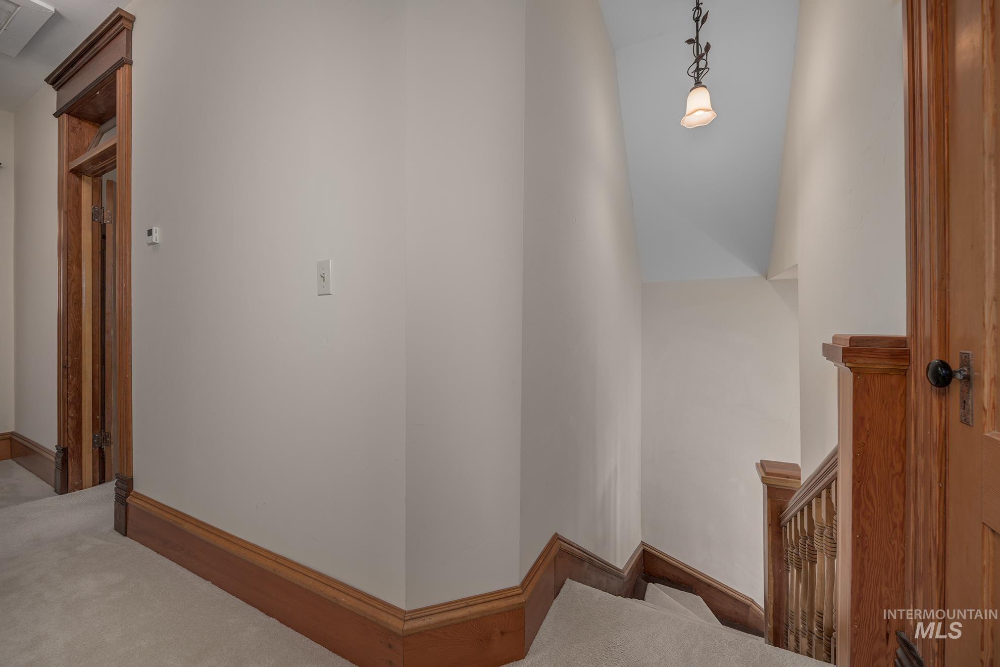 548 West 2nd Street Weiser, ID 83672 - Photo 22 of 50 Hallway featuring carpet floors and an upstairs landing