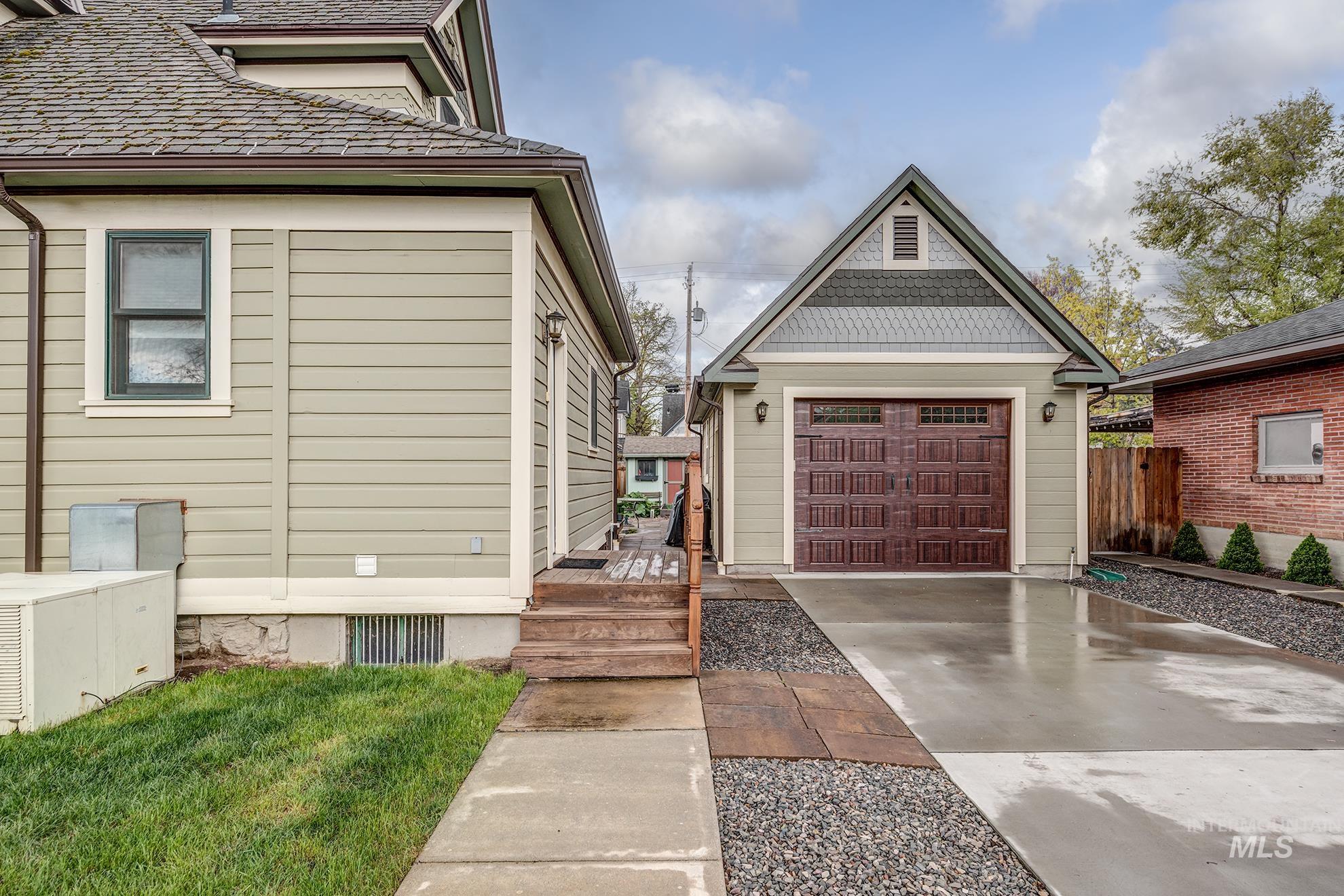 548 West 2nd Street Weiser, ID 83672 - Photo 37 of 50 View of home's exterior featuring driveway, an outbuilding, and a detached garage
