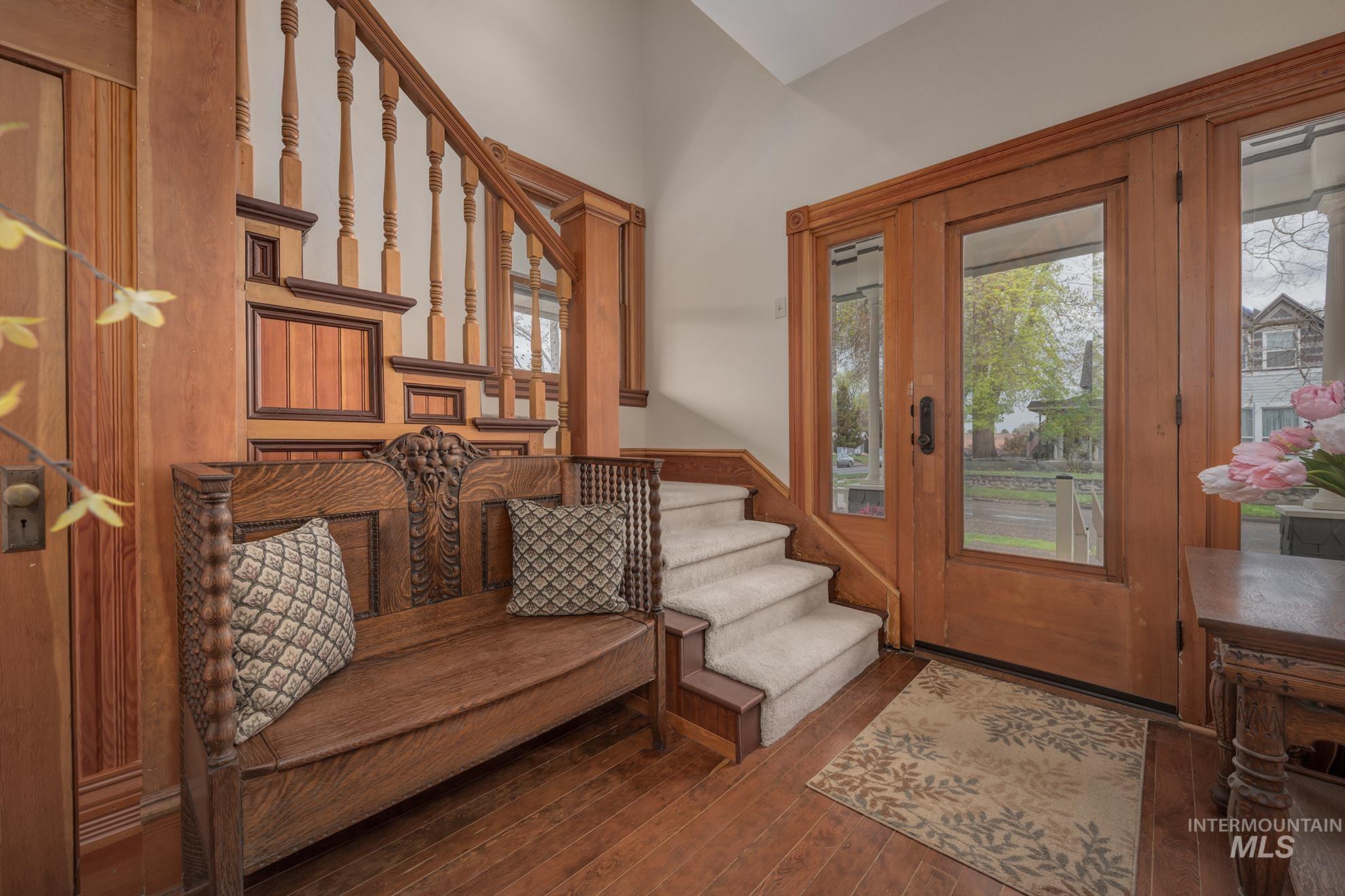 548 West 2nd Street Weiser, ID 83672 - Photo 4 of 50 Foyer with dark wood-style floors and a wainscoted wall