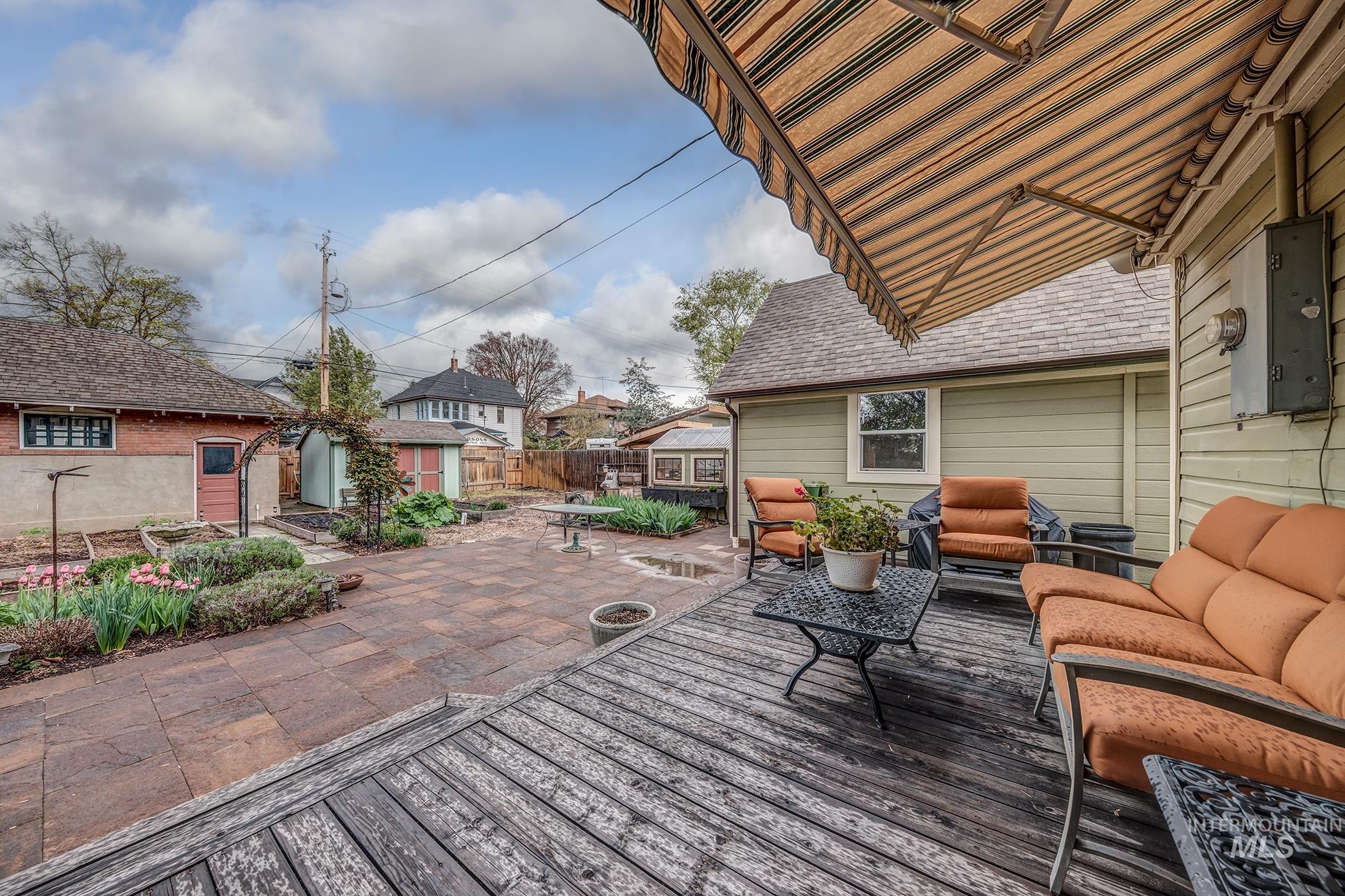 548 West 2nd Street Weiser, ID 83672 - Photo 45 of 50 Wooden deck with outdoor furniture, a patio, and a shed