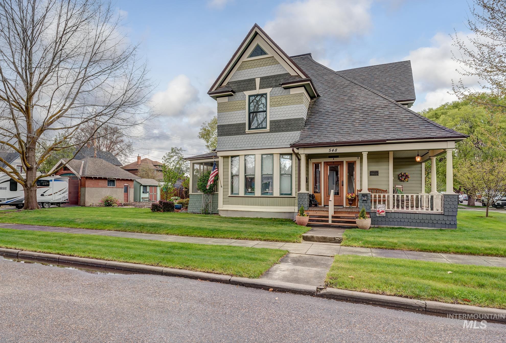 548 West 2nd Street Weiser, ID 83672 - Photo 50 of 50 Victorian-style house with a front lawn, a porch, and roof with shingles