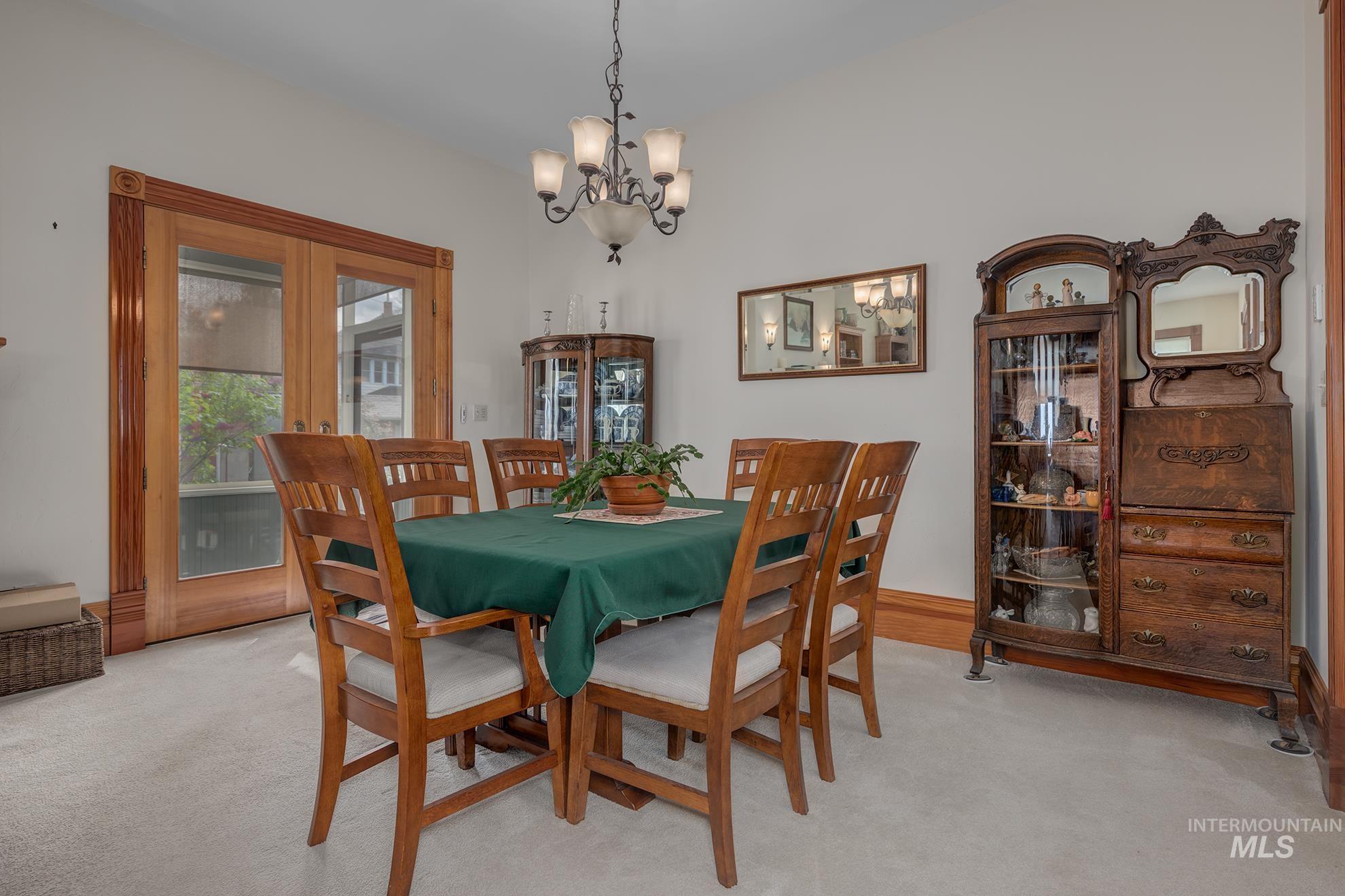 548 West 2nd Street Weiser, ID 83672 - Photo 10 of 50 Dining space featuring light carpet and hanging lights