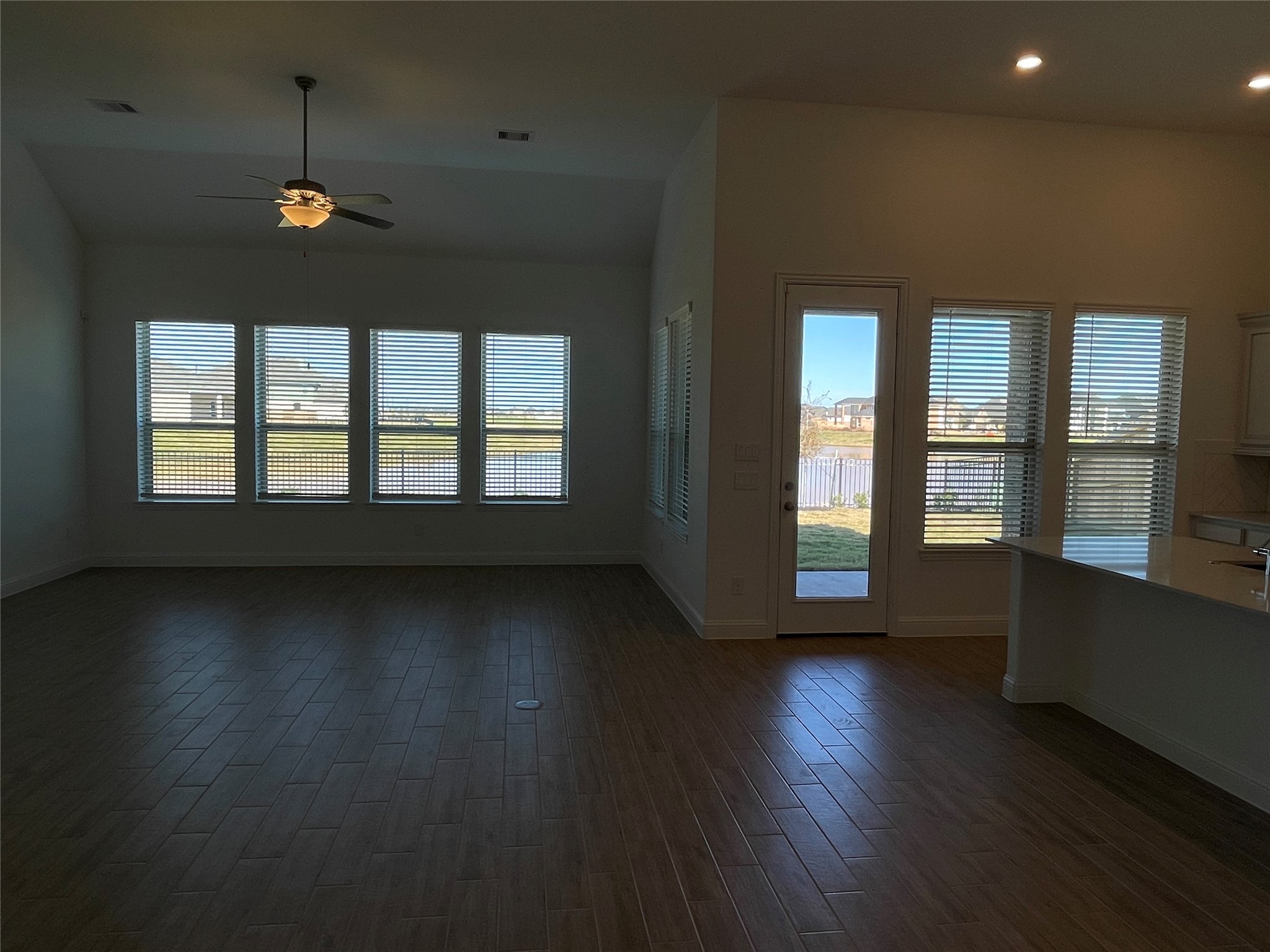 29806 Cherry Vine Road Katy, TX 77494 - Photo 11 of 30 an empty room with wooden floor and windows