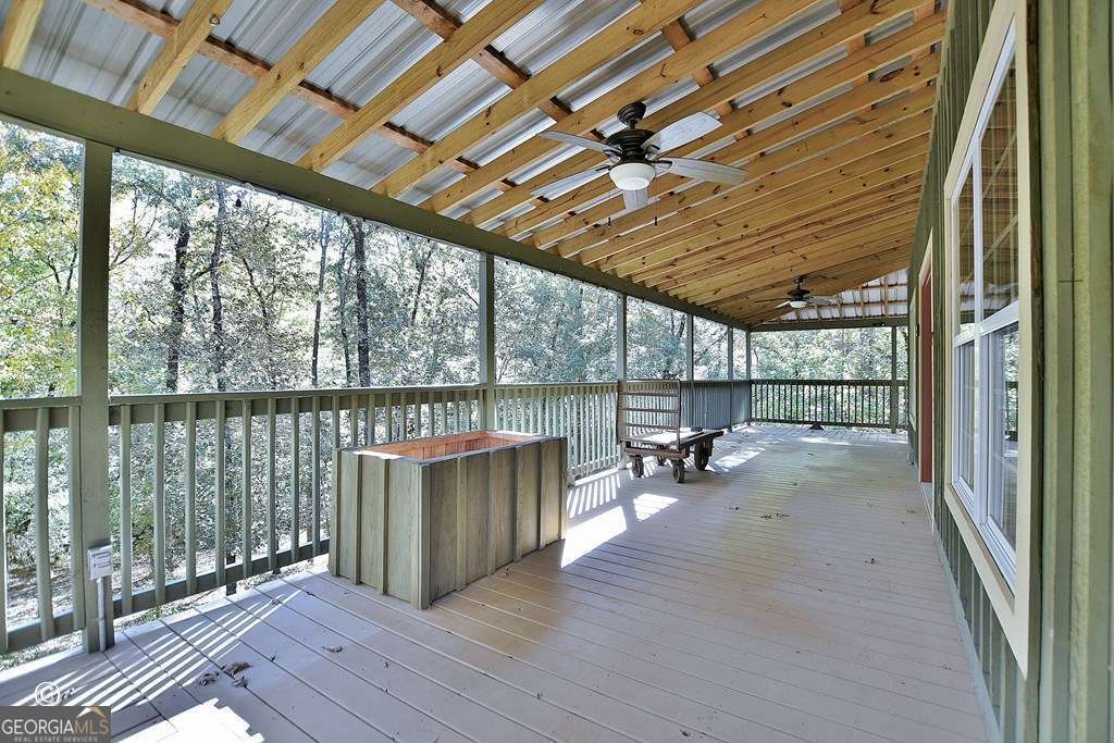 3175 Salem Road Pine Mountain, GA 31822 - Photo 13 of 41 a view of a deck with wooden floor and roof with a glass door