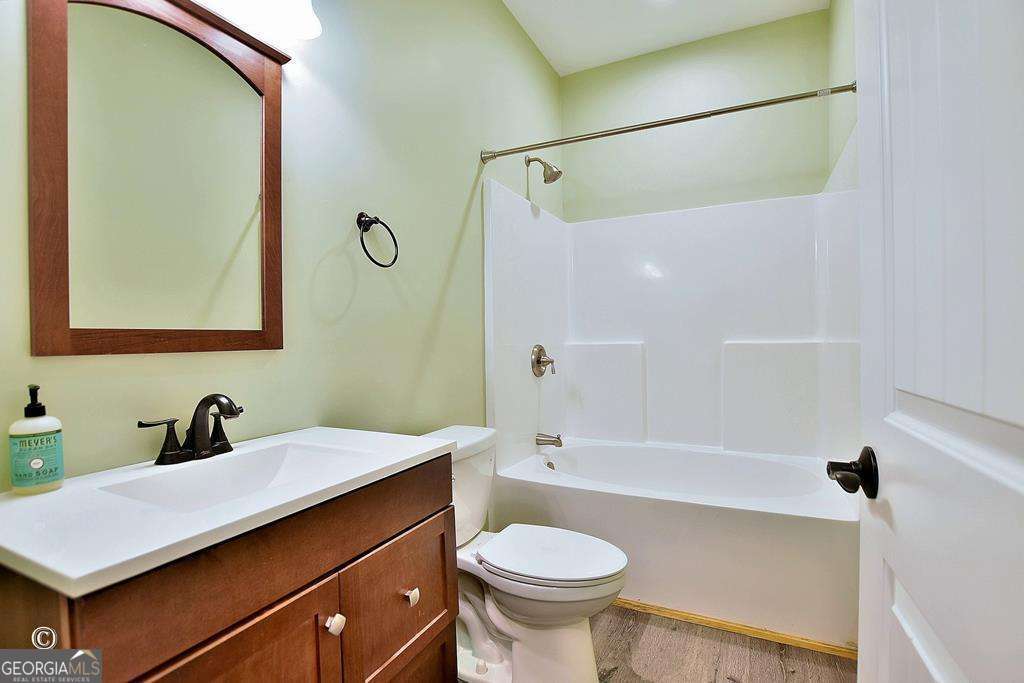3175 Salem Road Pine Mountain, GA 31822 - Photo 37 of 41 a bathroom with a sink toilet a mirror and shower