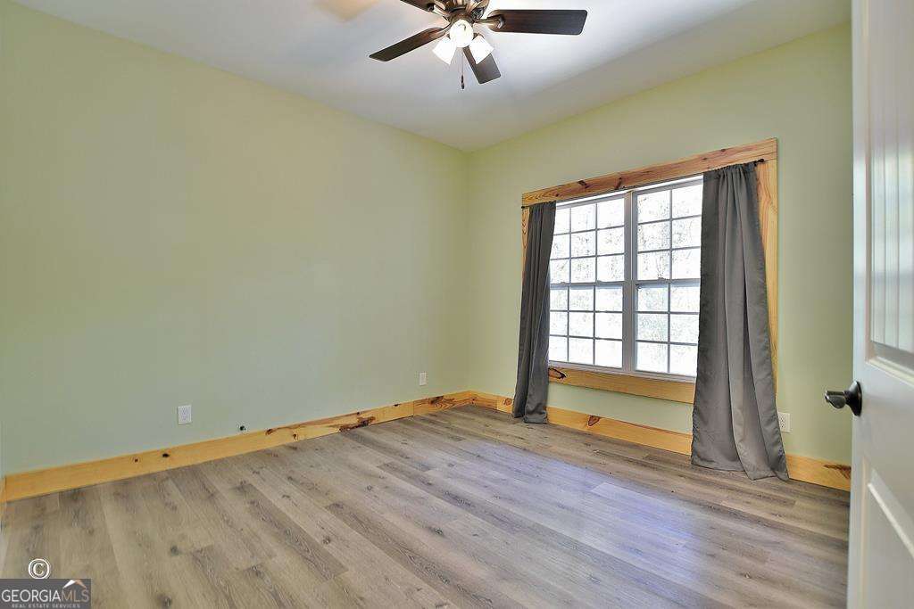 3175 Salem Road Pine Mountain, GA 31822 - Photo 38 of 41 an empty room with wooden floor and windows