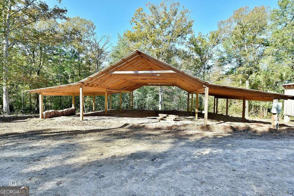 3175 Salem Road Pine Mountain, GA 31822 - Photo 8 of 41 a backyard of a house with large trees and outdoor seating
