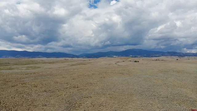 a view of mountain and an ocean