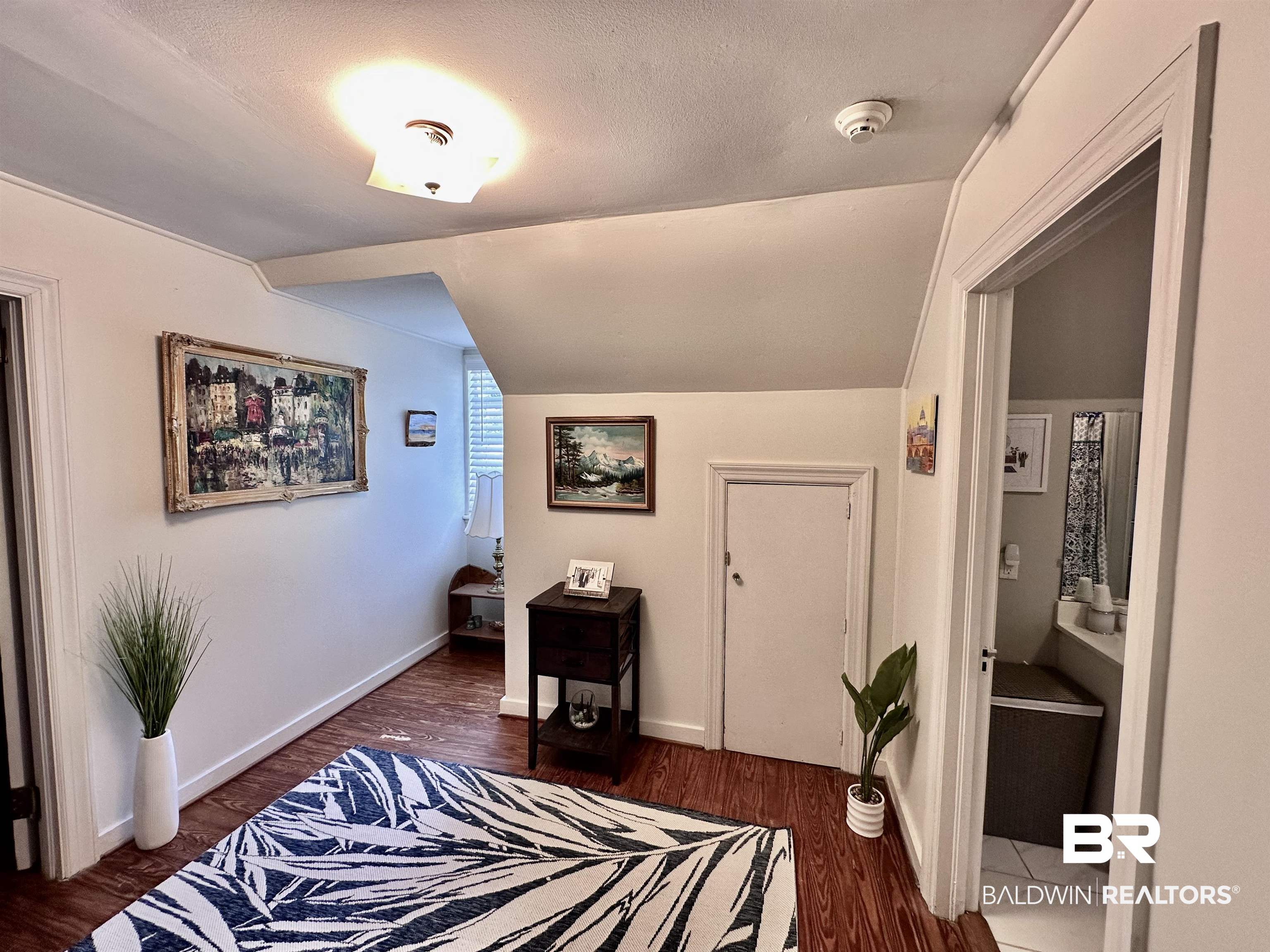 260 Siena Vista Street Mobile, AL 36607 - Photo 26 of 41 Bedroom with lofted ceiling, wood finished floors, and baseboards