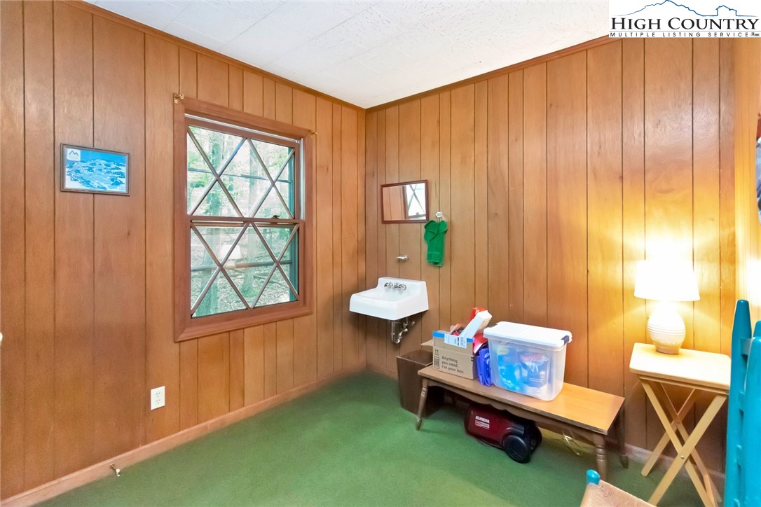 206 Oak Road Beech Mountain, NC 28604 - Photo 13 of 22 a living room with furniture and a window