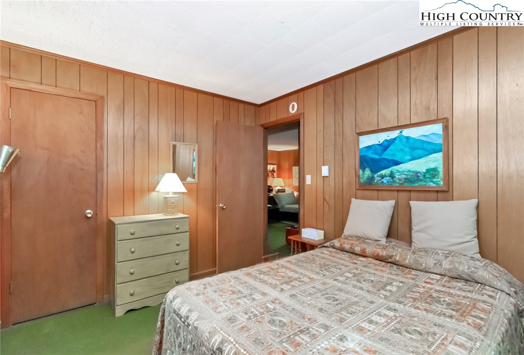 206 Oak Road Beech Mountain, NC 28604 - Photo 21 of 22 a bedroom with a bed and a dresser