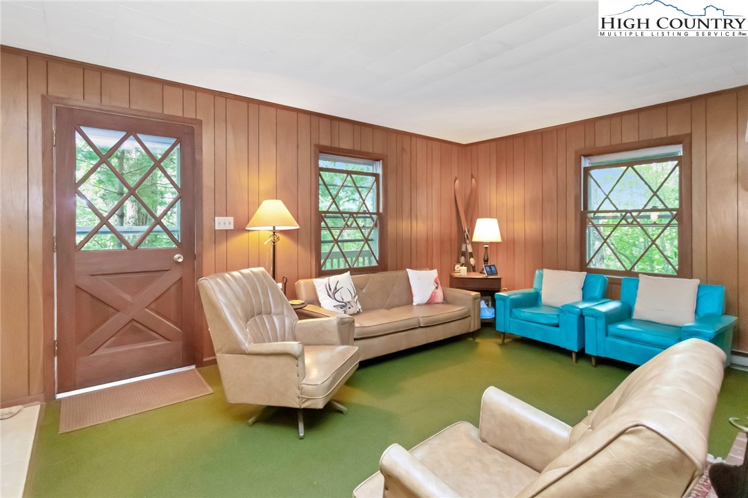 206 Oak Road Beech Mountain, NC 28604 - Photo 6 of 22 a living room with furniture and a large window