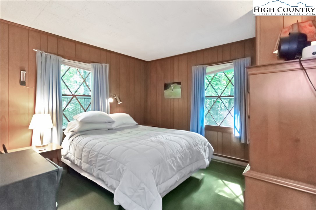 206 Oak Road Beech Mountain, NC 28604 - Photo 10 of 22 a bedroom with a bed and window