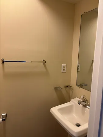 a bathroom with a sink and mirror