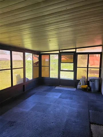 a view of an empty room with a large window