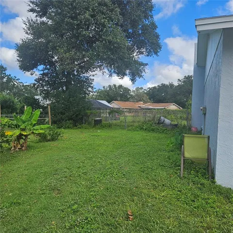 a view of a garden with a bench in a garden