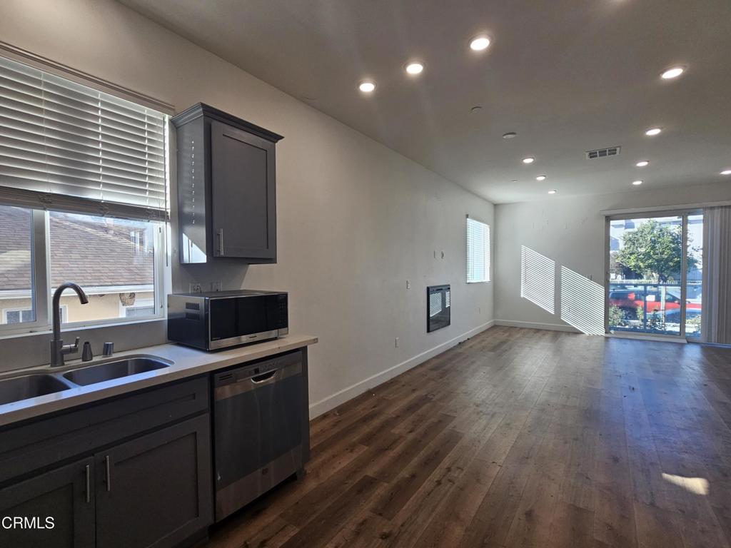 14550 Burbank Boulevard, Unit 103 Sherman Oaks, CA 91411 - Photo 11 of 27 a kitchen with granite countertop a sink and cabinets