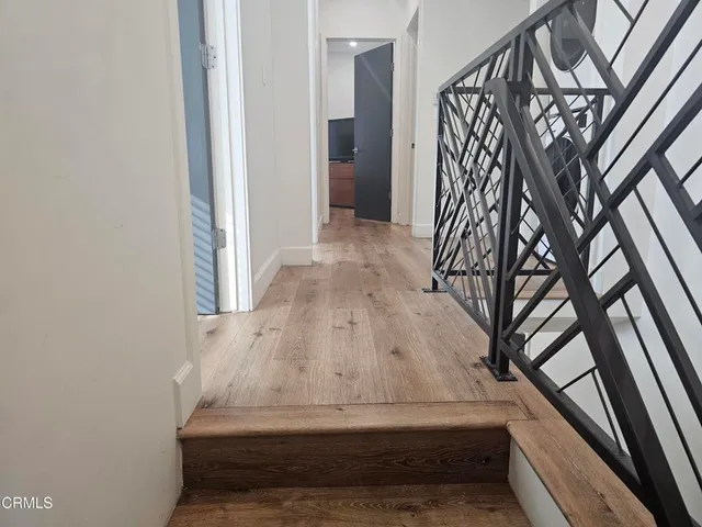 a white toilet sitting next to a bath tub