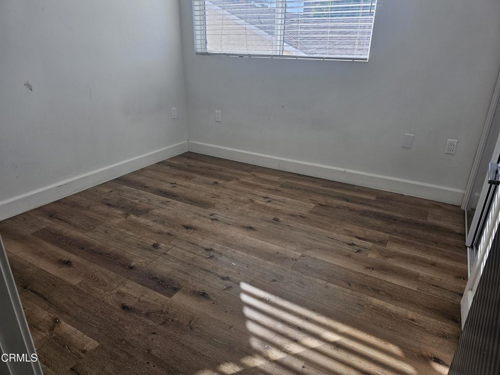 14550 Burbank Boulevard, Unit 103 Sherman Oaks, CA 91411 - Photo 19 of 27 a view of wooden floor and windows in a room