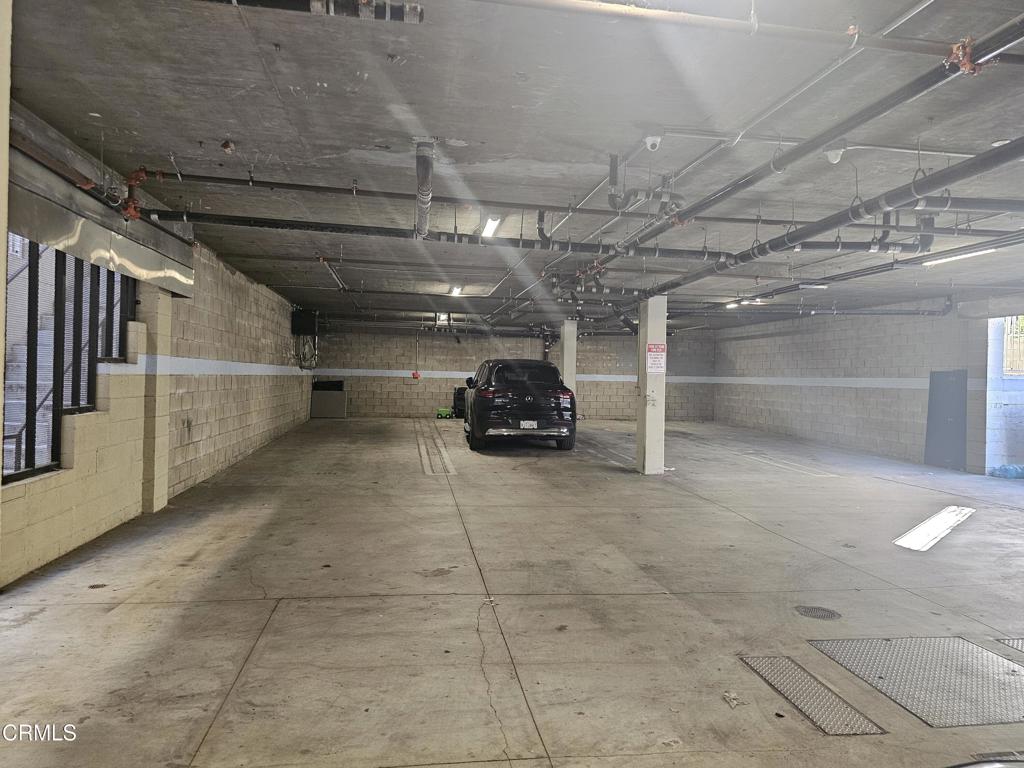 14550 Burbank Boulevard, Unit 103 Sherman Oaks, CA 91411 - Photo 25 of 27 a car parked in a garage