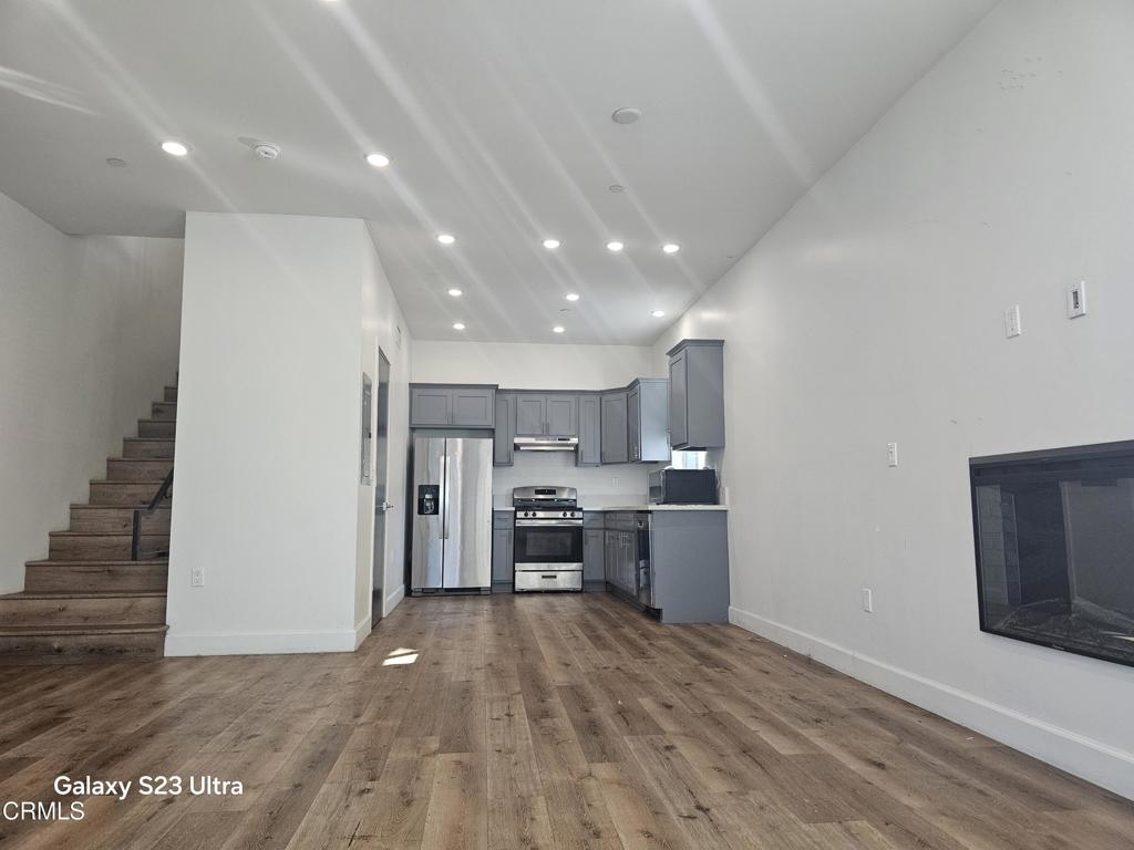 14550 Burbank Boulevard, Unit 103 Sherman Oaks, CA 91411 - Photo 6 of 27 a view of kitchen with refrigerator microwave and cabinets