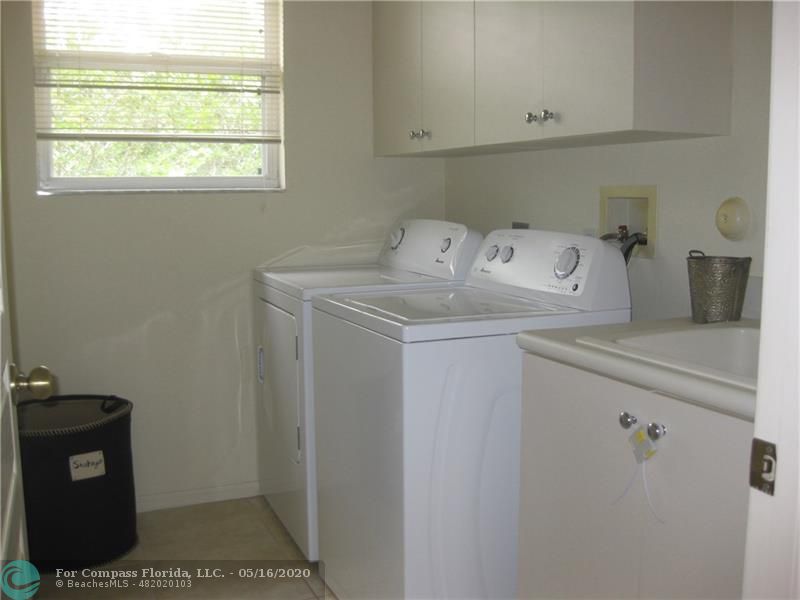 Nautica Isles Greenacres, FL 33463 - Photo 32 of 35 LAUNDRY ROOM UPSTAIRS WITH SINK