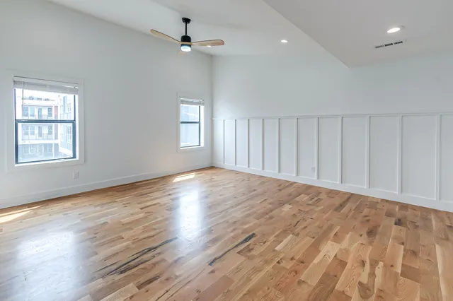 a bathroom with a toilet a sink and a mirror