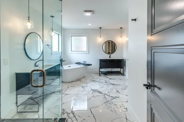 a living room with a mirror and a clock