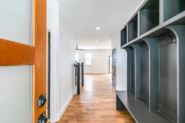 a view of hallway with wooden floor