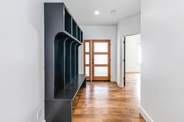 a view of entryway with wooden floor