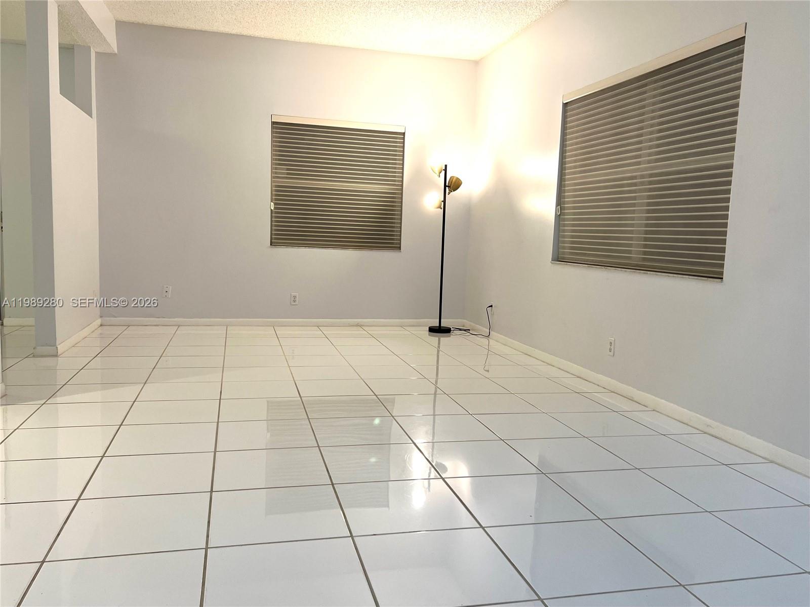543 Racquet Club Road, Unit 33 Weston, FL 33326 - Photo 6 of 28 a view of an empty room with a window