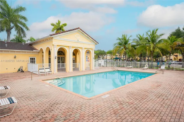 a view of a house with swimming pool