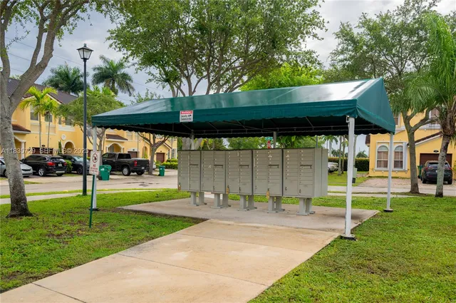 a view of a park with a large tree